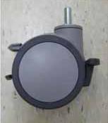 This is a furniture caster wheel with a brake mechanism and a stem mount