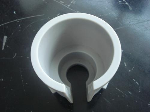This appears to be a plastic cup used for bowl brush storage, also known as a bowl brush caddy