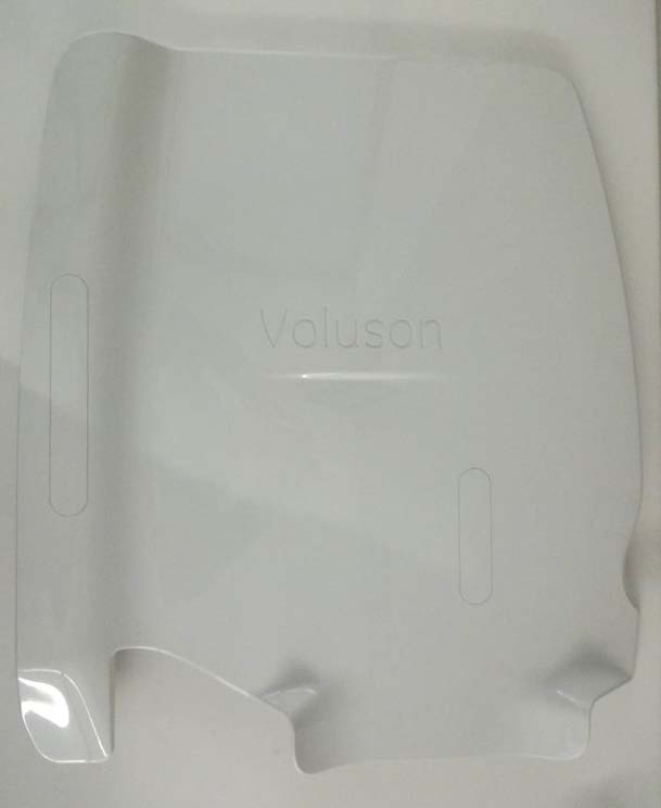 This is a white plastic cover with the "Voluson" brand name, likely for a piece of medical equipment or a related accessory
