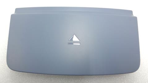 This is a car bumper tow hook cover.
