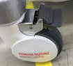 The image shows an Airwheel self-balancing electric scooter, likely a Q1 or Q3 model