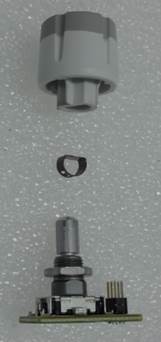 This is an electronic rotary encoder. It is a digital device used to detect rotation and direction, typically used for controls in electronic devices