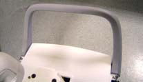 This appears to be a white, foldable safety grab bar or assist rail