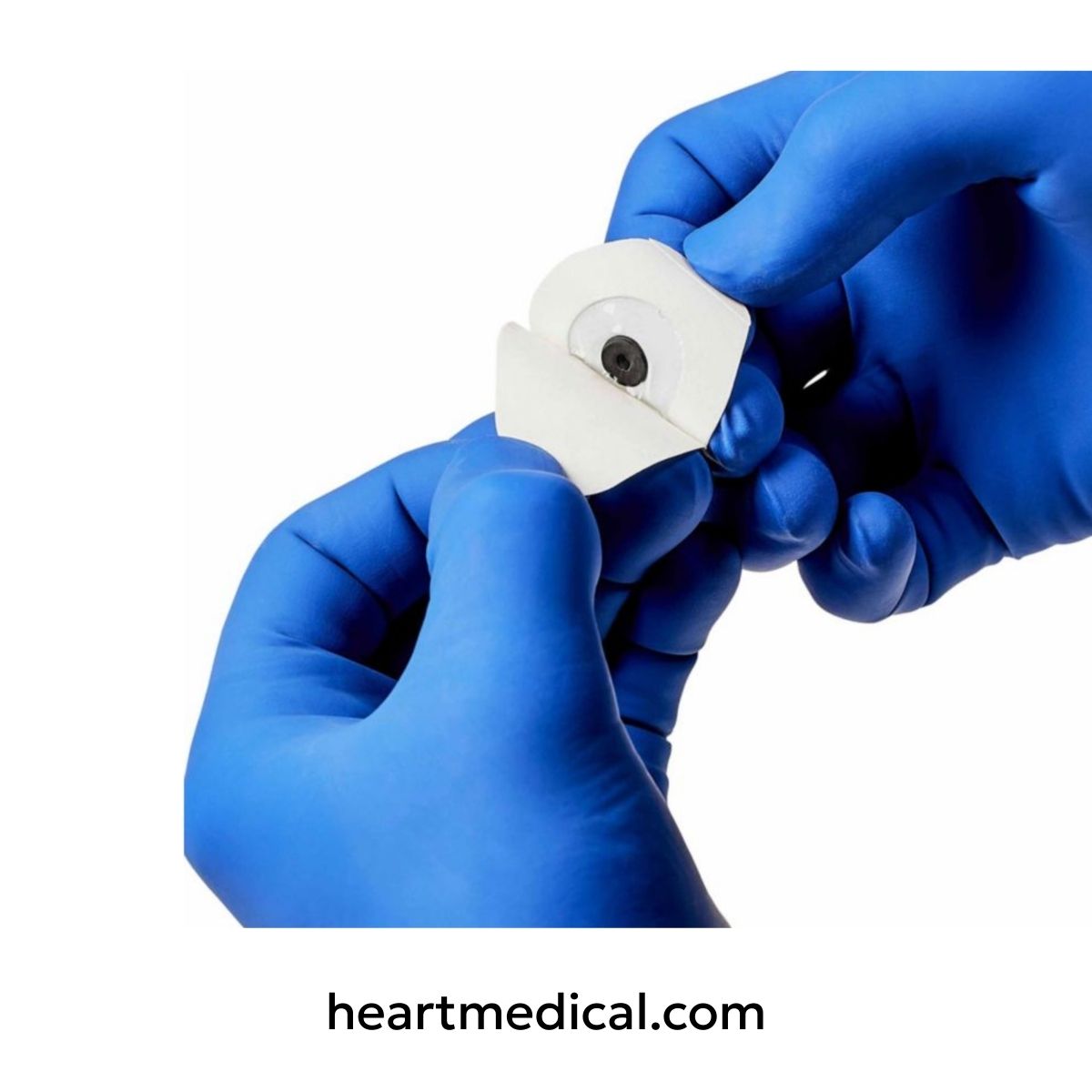 Hands in blue gloves holding a medical device with 'heartmedical.com' branding.