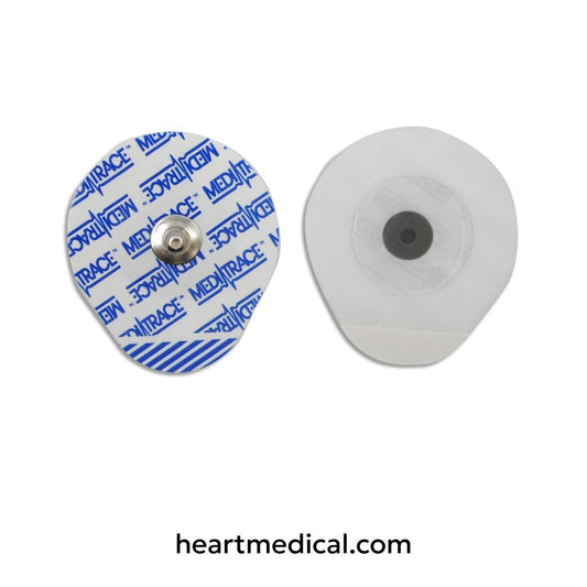 Two ECG electrodes with adhesive backing on a white background, branded 'Medtrac'.