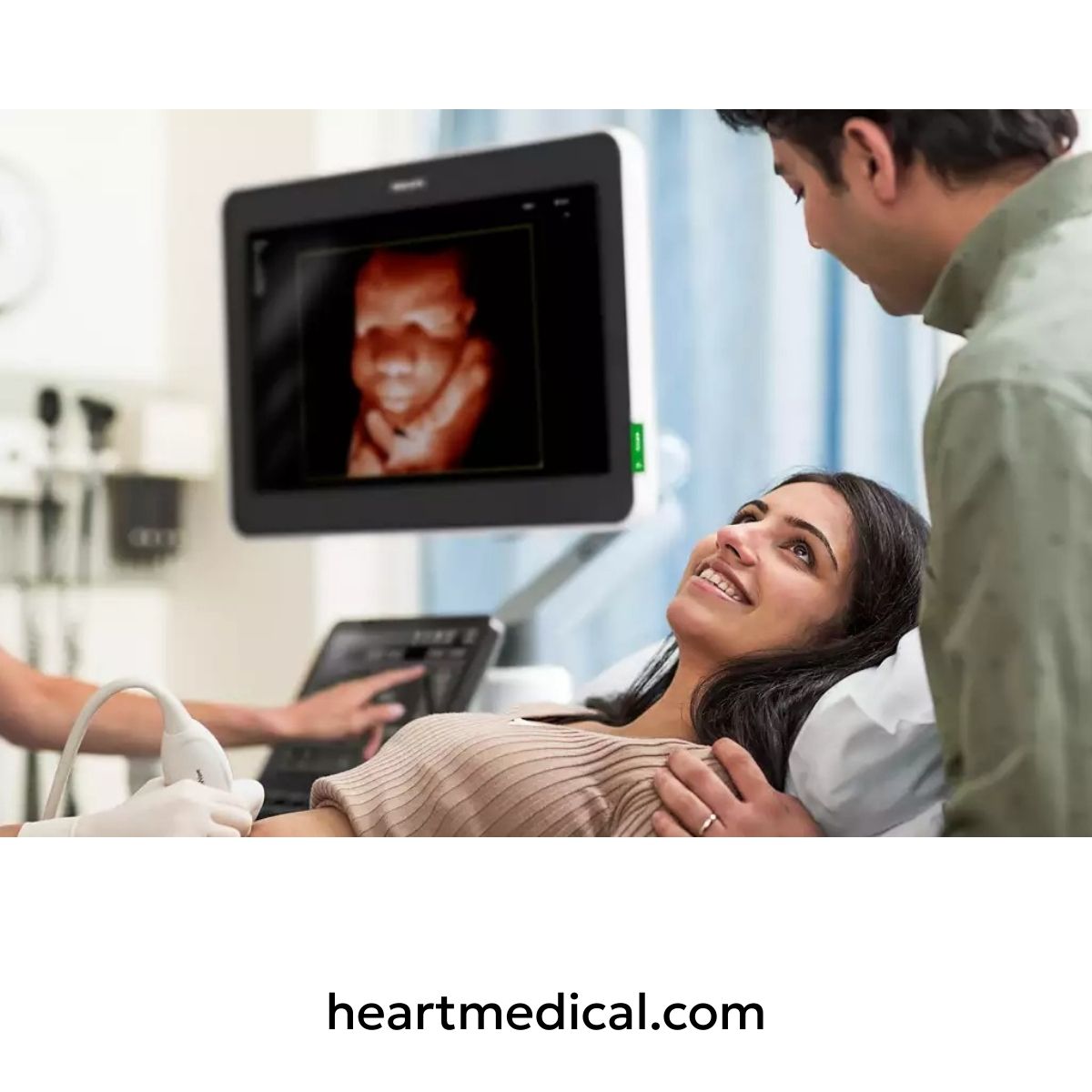 Philips EPIQ Elite ultrasound system performing 3D obstetric scan with patient viewing fetal image