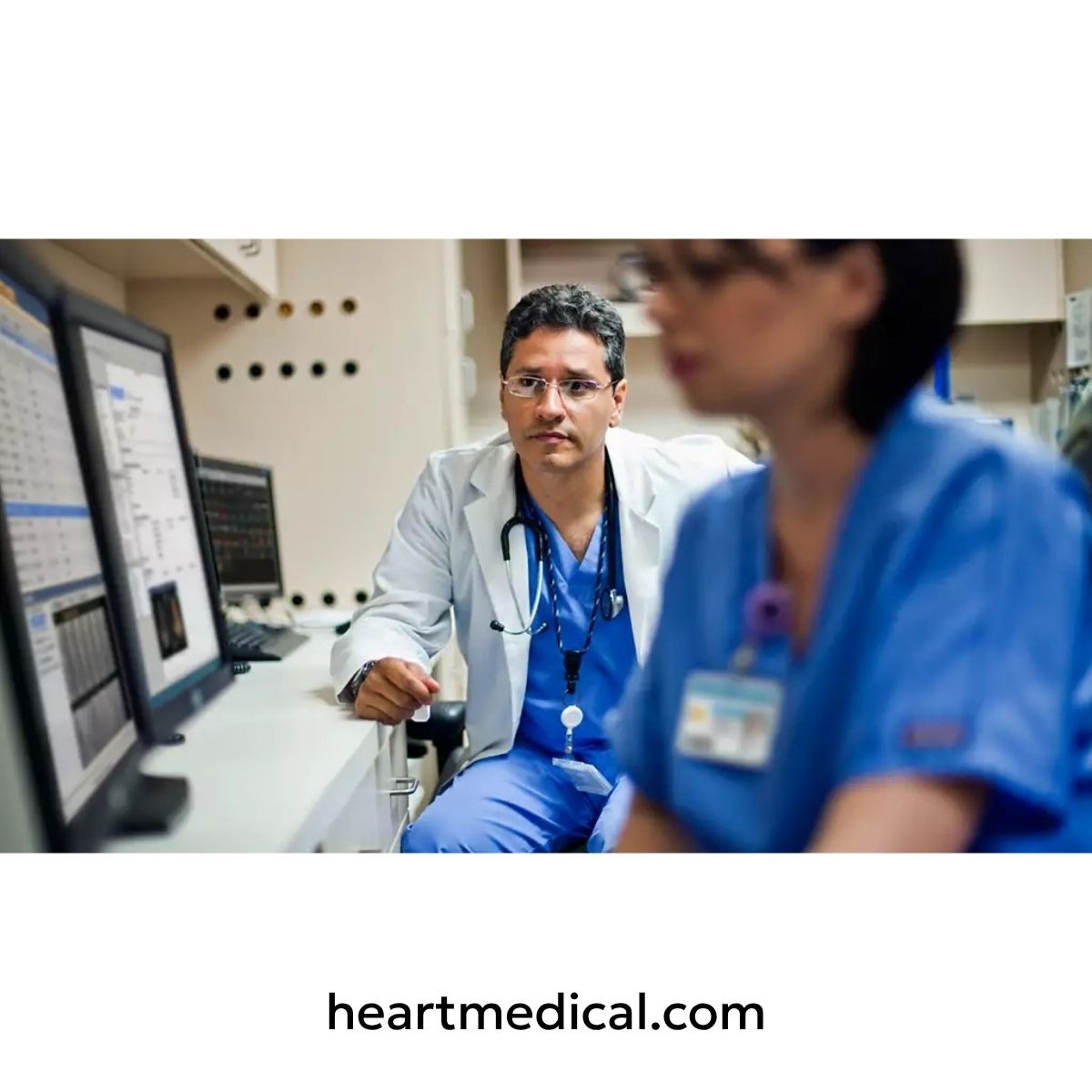 Doctor reviewing patient data on a computer using Philips Ultrasound Workspace in a clinical setting